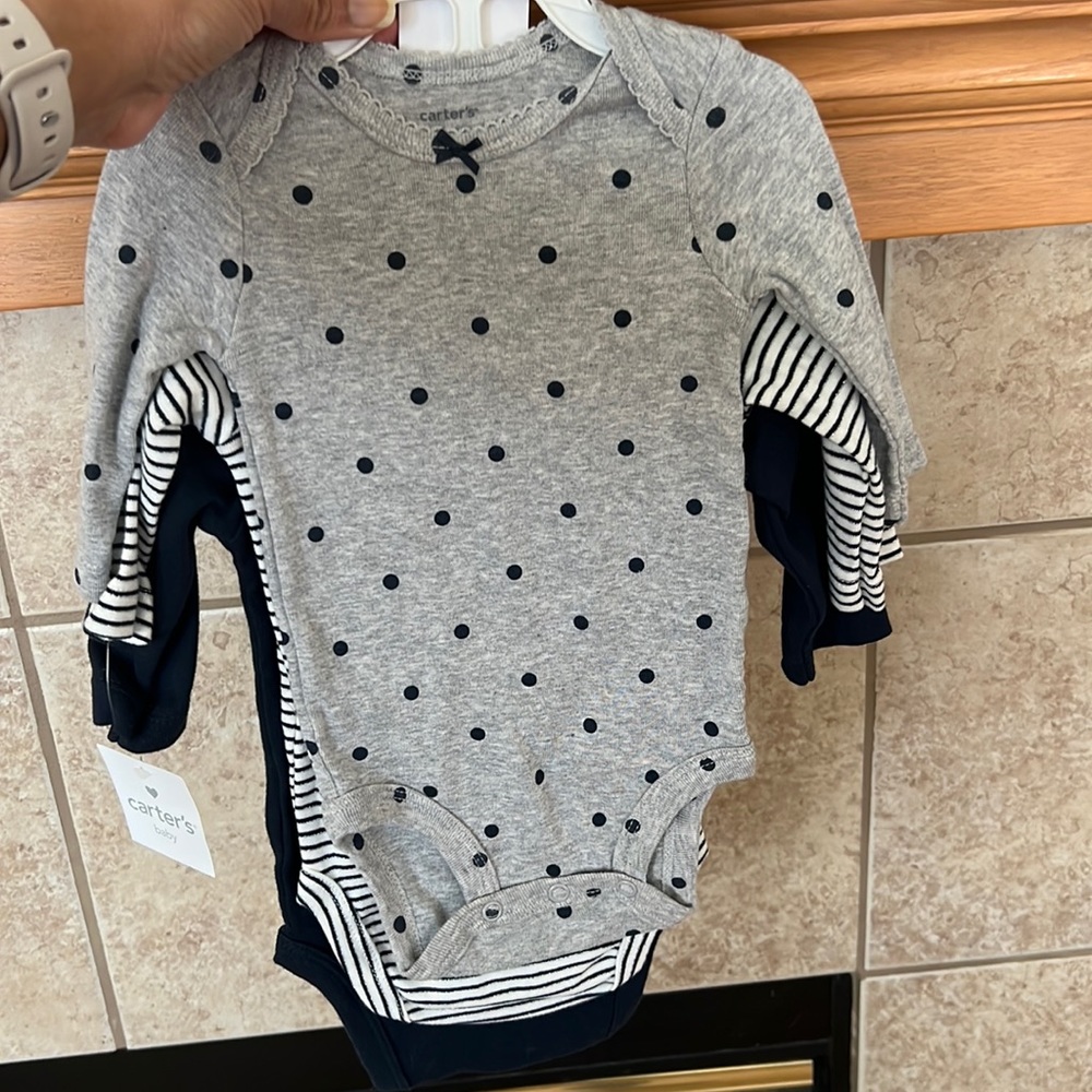 Baby clothes new with tags. 3/4 sleeve 3 months carters bodysuit.